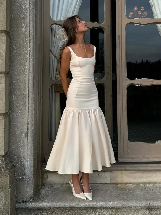 Roma
Elegant cream midi dress with a dropped waist